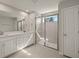Spacious bathroom with double vanity, large shower, and plenty of storage at 31496 Woodland Race Loop, Wesley Chapel, FL 33545
