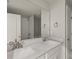 Modern bathroom with double vanity and a large mirror at 31496 Woodland Race Loop, Wesley Chapel, FL 33545