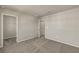 Bright bedroom with neutral walls, carpet flooring, and a walk-in closet at 31496 Woodland Race Loop, Wesley Chapel, FL 33545