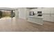 Open concept kitchen with island and stainless steel appliances at 31496 Woodland Race Loop, Wesley Chapel, FL 33545