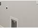 Bright laundry room with utility hookups and pet door at 31496 Woodland Race Loop, Wesley Chapel, FL 33545