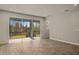 Living area with sliding glass doors and view of backyard at 31496 Woodland Race Loop, Wesley Chapel, FL 33545