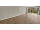 Bright living room with sliding glass doors leading to a patio at 31496 Woodland Race Loop, Wesley Chapel, FL 33545
