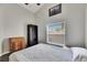 Bright bedroom featuring a comfortable bed and built-in shelving at 31935 Brookstone Dr, Wesley Chapel, FL 33545