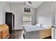 Spacious bedroom with a large bed, hardwood floors and a large window at 31935 Brookstone Dr, Wesley Chapel, FL 33545