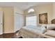 Bedroom with double doors to the closet and ensuite bath at 31935 Brookstone Dr, Wesley Chapel, FL 33545