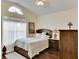 Bedroom with a wood-look floor and ceiling fan at 31935 Brookstone Dr, Wesley Chapel, FL 33545