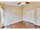 Bedroom with ceiling fan and double door closet at 31935 Brookstone Dr, Wesley Chapel, FL 33545