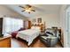 Relaxing Primary bedroom with a ceiling fan and en-suite bathroom at 31935 Brookstone Dr, Wesley Chapel, FL 33545