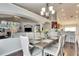 Bright dining room features a spacious table with six chairs, hardwood floors, and a chandelier at 31935 Brookstone Dr, Wesley Chapel, FL 33545