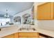 Kitchen features a double sink and views into the dining area at 31935 Brookstone Dr, Wesley Chapel, FL 33545