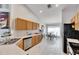 Bright kitchen boasts wood cabinets, stainless steel appliances, and tile flooring at 31935 Brookstone Dr, Wesley Chapel, FL 33545