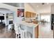 Open kitchen features wood cabinets, stainless steel appliances, and a breakfast bar at 31935 Brookstone Dr, Wesley Chapel, FL 33545