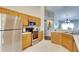 Modern kitchen with stainless steel appliances and wood cabinets at 31935 Brookstone Dr, Wesley Chapel, FL 33545