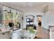 Living room with hardwood floors, sliding glass doors, and comfortable seating at 31935 Brookstone Dr, Wesley Chapel, FL 33545
