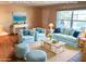 Staged living room with comfortable seating, stylish decor, and abundant natural light at 9157 42Nd N Way, Pinellas Park, FL 33782