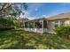 Home exterior showcasing a spacious backyard at 2003 Acadia Greens Dr, Sun City Center, FL 33573