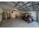 Garage with golf cart and storage shelving at 2003 Acadia Greens Dr, Sun City Center, FL 33573