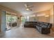 Living room with a sectional sofa and sliding glass doors to patio at 2003 Acadia Greens Dr, Sun City Center, FL 33573