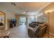 Living room with a sectional sofa and sliding glass doors to patio at 2003 Acadia Greens Dr, Sun City Center, FL 33573