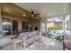 Bright sunroom with comfy seating and views at 2003 Acadia Greens Dr, Sun City Center, FL 33573