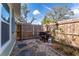 Small side yard with grill and stone path at 4709 N Willis St, Tampa, FL 33603