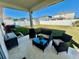 Covered patio with seating area and outdoor grill at 6625 Pebblebrooke Way, Zephyrhills, FL 33541