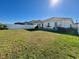 Large backyard with grassy area and privacy fence at 6625 Pebblebrooke Way, Zephyrhills, FL 33541