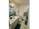 Clean bathroom with vanity, toilet, and shower/tub combo at 6625 Pebblebrooke Way, Zephyrhills, FL 33541