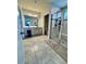 Elegant bathroom with double vanity, large shower, and tile flooring at 6625 Pebblebrooke Way, Zephyrhills, FL 33541