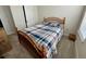 Charming bedroom with wood framed bed and ceiling fan at 6625 Pebblebrooke Way, Zephyrhills, FL 33541
