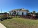 Community clubhouse with landscaping and festive decor at 6625 Pebblebrooke Way, Zephyrhills, FL 33541