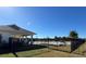 Community pool with covered patio area and fencing at 6625 Pebblebrooke Way, Zephyrhills, FL 33541
