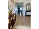Light and airy entryway, showcasing wood-look floors and views to the living room at 6625 Pebblebrooke Way, Zephyrhills, FL 33541