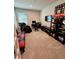 Bright home office features built-in shelving and comfortable seating at 6625 Pebblebrooke Way, Zephyrhills, FL 33541