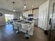 Modern kitchen with granite countertops and white cabinets at 6625 Pebblebrooke Way, Zephyrhills, FL 33541
