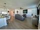 Living area with hardwood floors and grey sofas at 6625 Pebblebrooke Way, Zephyrhills, FL 33541
