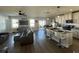 Spacious living room with hardwood floors and grey sofas at 6625 Pebblebrooke Way, Zephyrhills, FL 33541