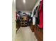 Large walk-in closet with ample shelving and hanging space at 6625 Pebblebrooke Way, Zephyrhills, FL 33541
