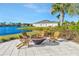 Enjoy a fire pit with Adirondack chairs overlooking a lake at 11728 Cambium Crown Dr, Riverview, FL 33569