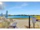 Relaxing lakefront patio with lounge chairs and fire pit at 11728 Cambium Crown Dr, Riverview, FL 33569