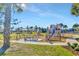 Community playground with swings, slides, and play structures at 11728 Cambium Crown Dr, Riverview, FL 33569