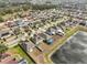 Neighborhood view with lake and houses at 14319 Italia Dr, Wimauma, FL 33598