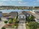 Two-story house with lake view and solar panels at 14319 Italia Dr, Wimauma, FL 33598