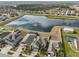 House with solar panels and lake view at 14319 Italia Dr, Wimauma, FL 33598