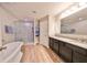 Spa-like bathroom with soaking tub and walk-in shower at 14319 Italia Dr, Wimauma, FL 33598