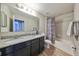 Bathroom with granite countertop, double sinks, and tub at 14319 Italia Dr, Wimauma, FL 33598