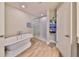 Bathroom with large soaking tub and walk-in shower at 14319 Italia Dr, Wimauma, FL 33598