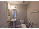 Simple bathroom with pedestal sink, toilet and tile floor at 14319 Italia Dr, Wimauma, FL 33598