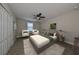 Bright bedroom with a large bed and two armchairs at 14319 Italia Dr, Wimauma, FL 33598